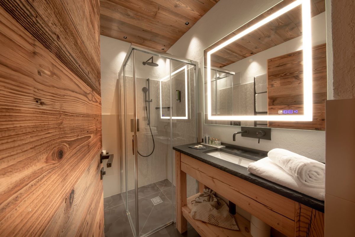 Bed with warm wooden walls