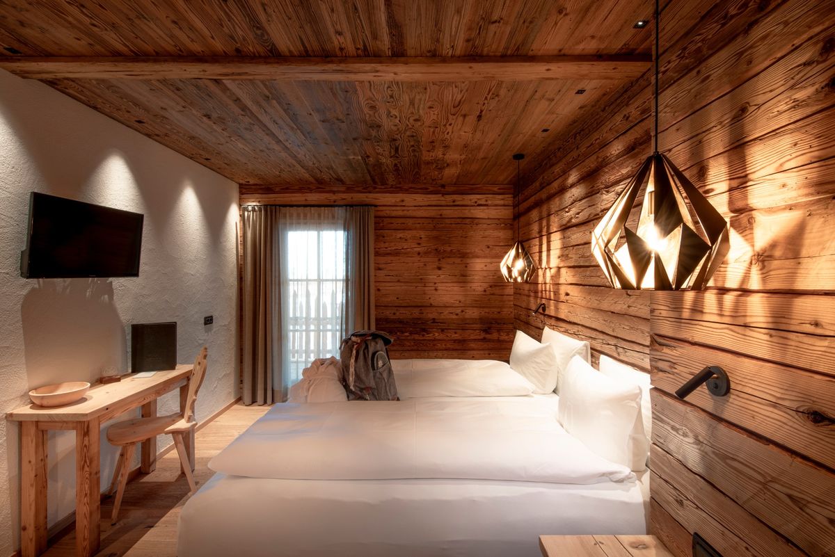 Cozy chalet bedroom with wooden walls