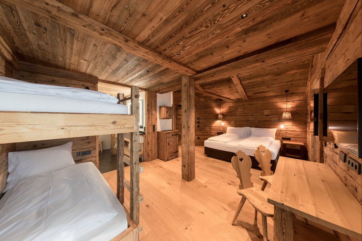 Cozy bedroom detail at Chalet Cortina d'Ampezzo